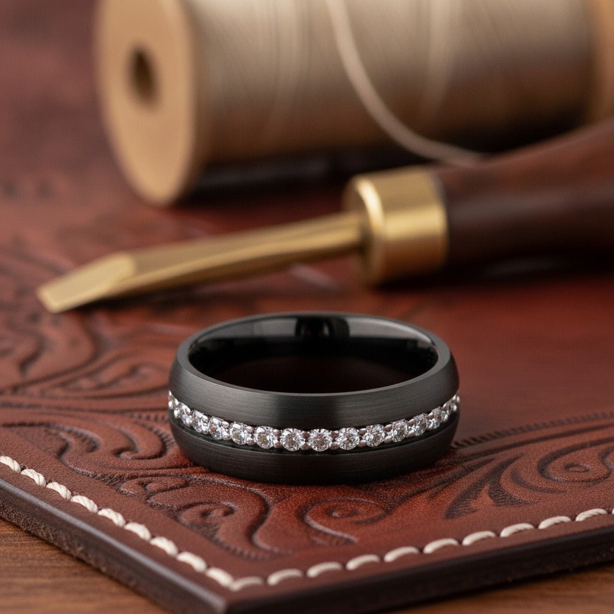 Aydins TSAR | Black Tungsten Ring with White Sapphires lifestyle scene, leather atelier