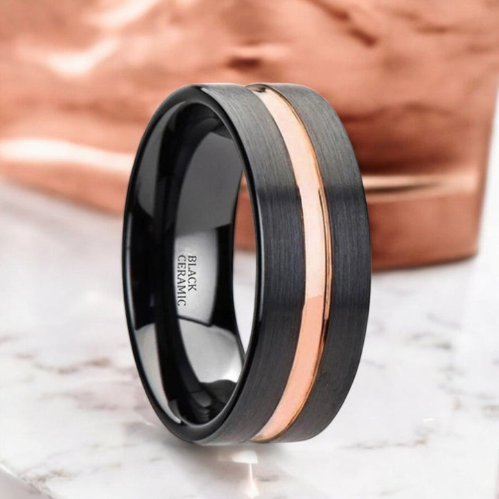 Black ceramic ring with brushed flat finish and luxurious rose gold groove, 4mm-10mm widths - Aydins Jewelry.