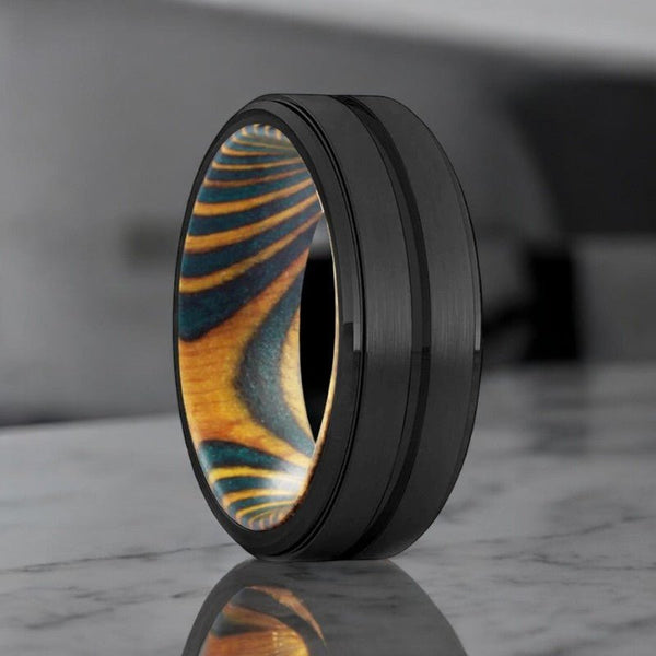 VERDURE black tungsten ring with green and yellow wood inner sleeve.