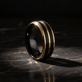 VERTEX — Luxury 3/4 angle on dark marble — men's tungsten wedding ring.