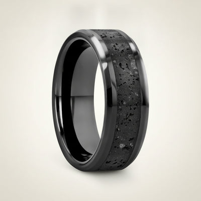 VESUVIUS polished black ceramic wedding band with black and gray lava rock stone inlay running around the band and polished beveled edges, studio hero shot
