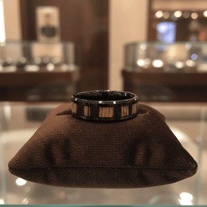 WILDSTRIPE — Premium boutique display on velvet — men's tungsten wedding ring.