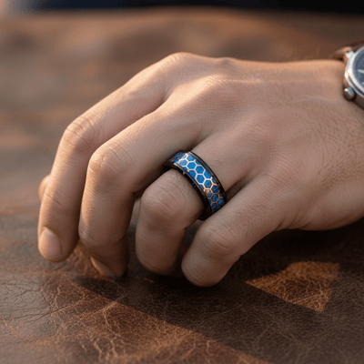 YANKTON — Lifestyle photo on hand — men's tungsten wedding ring.