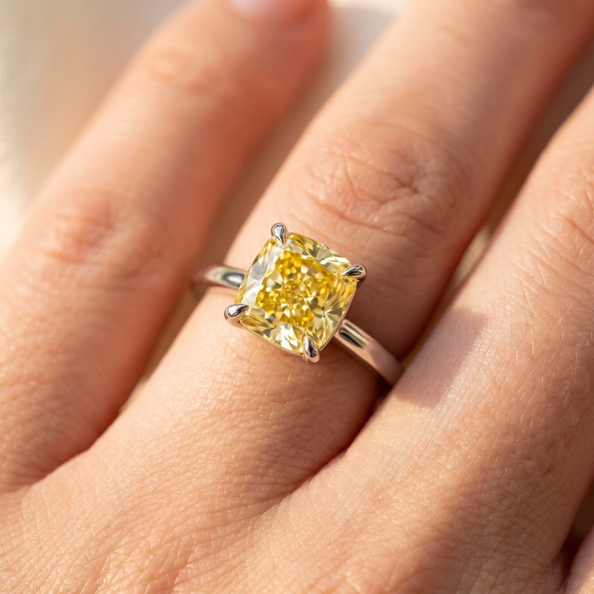 Yellow Cushion lab-grown diamond solitaire engagement ring, White Gold, on-finger close-up