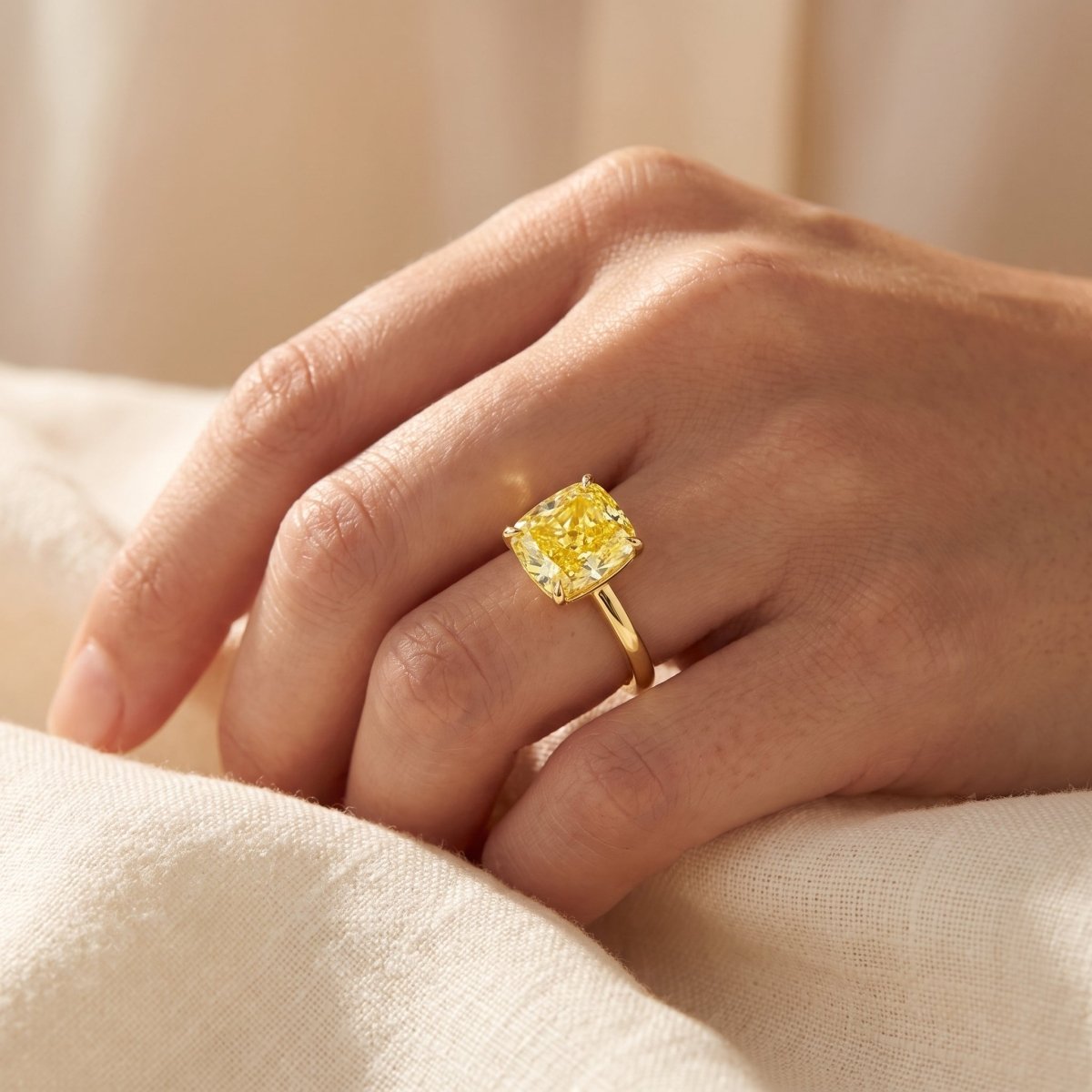 Yellow Cushion lab-grown diamond solitaire engagement ring, Yellow Gold, lifestyle photograph