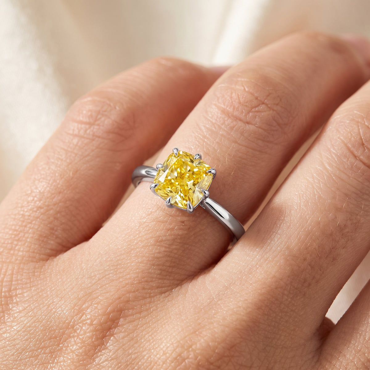 Yellow Cushion lab-grown diamond solitaire engagement ring, 925 Sterling Silver, on-finger close-up