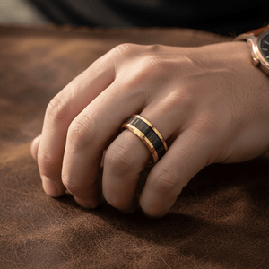 ZEBROSTA — Lifestyle photo on hand — men's tungsten wedding ring.