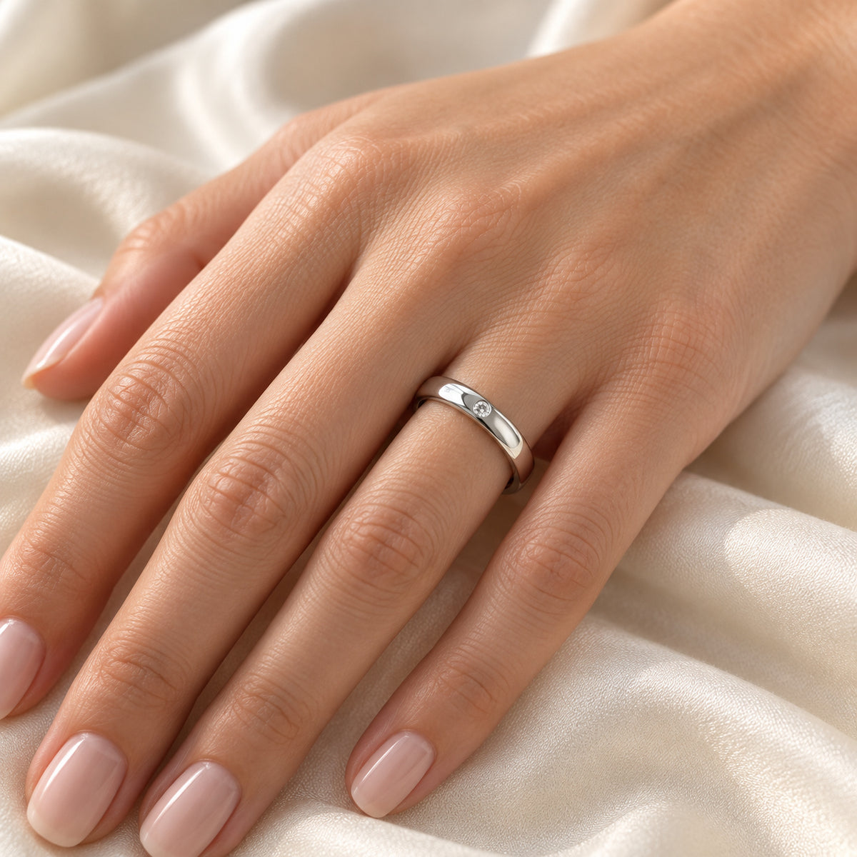 BERKSHIRE domed tungsten band with white diamond, on hand