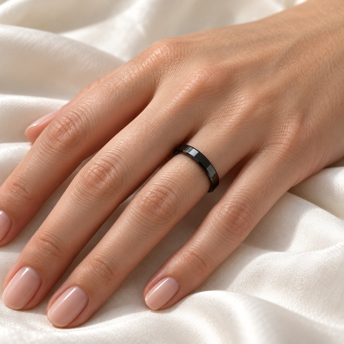 CITAR polished black ceramic band with beveled edges, on hand